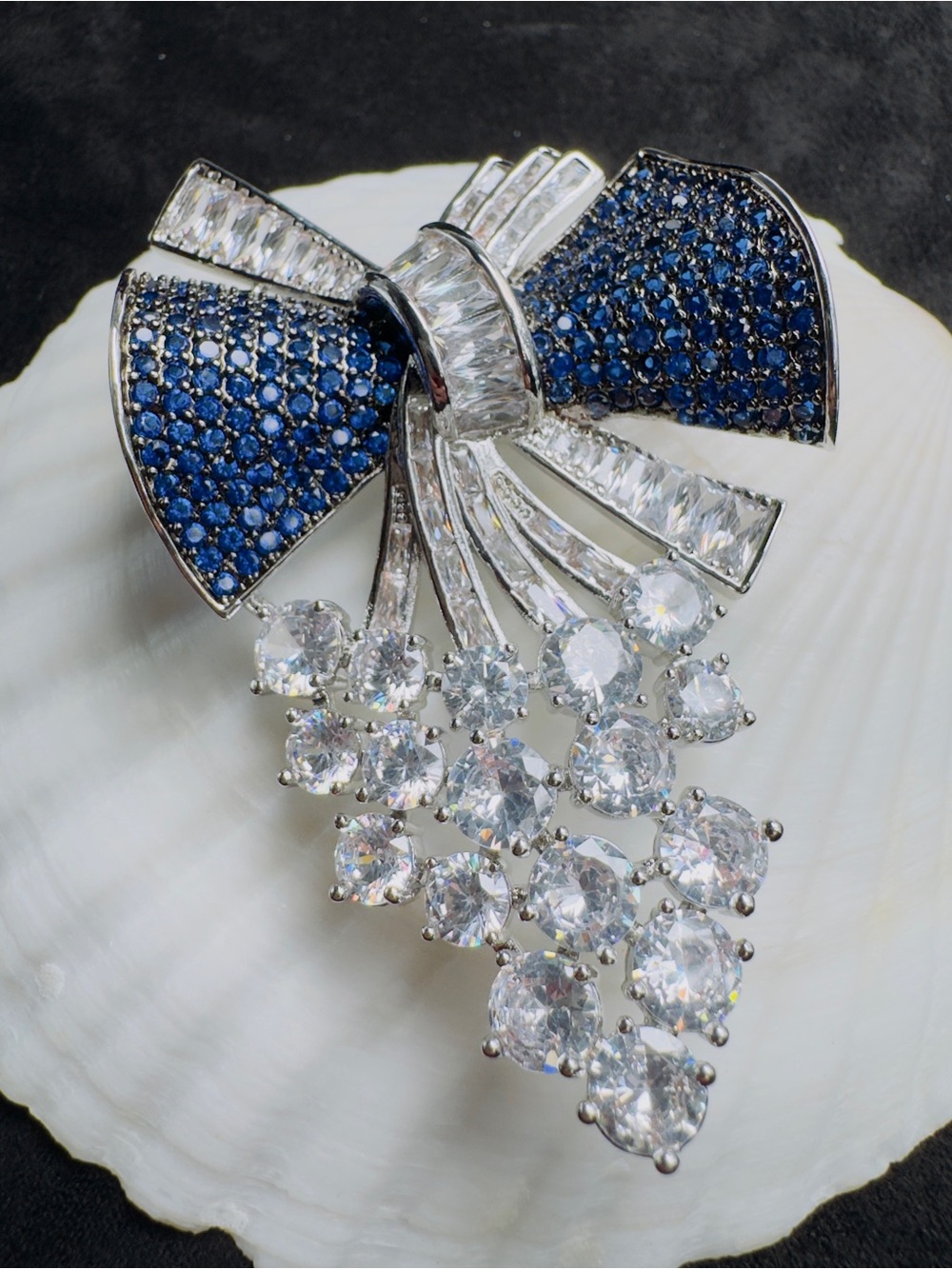 Elegant Blue Crystal Bow Brooch with Clear Droplet Accents